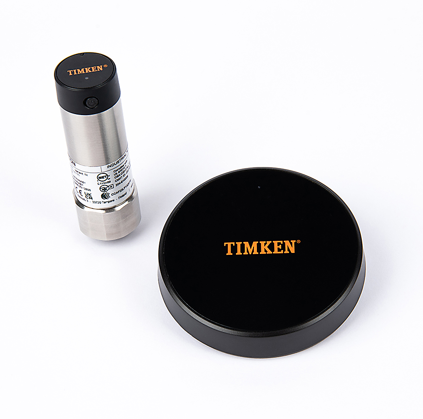 timken-wireless-sensor-and-gateway-863x871 A woman wearing safety glasses assembles part at a work bench