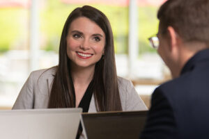 Nicole Morrett, Timken senior manager of talent, speaks with a coworker.